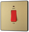 PCDSB74B Front - This Evolve Satin Brass 45A double pole switch with indicator from British General is ideal for use with cookers and ovens. This switch has a low profile screwless flat plate that clips on and off, making it ideal for modern interiors.