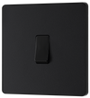 PCDMB13B Front - This Evolve Matt Black 20A 16AX intermediate light switch from British General should be used as the middle switch when you need to operate one light from 3 different locations, such as either end of a hallway and at the top of the stairs.